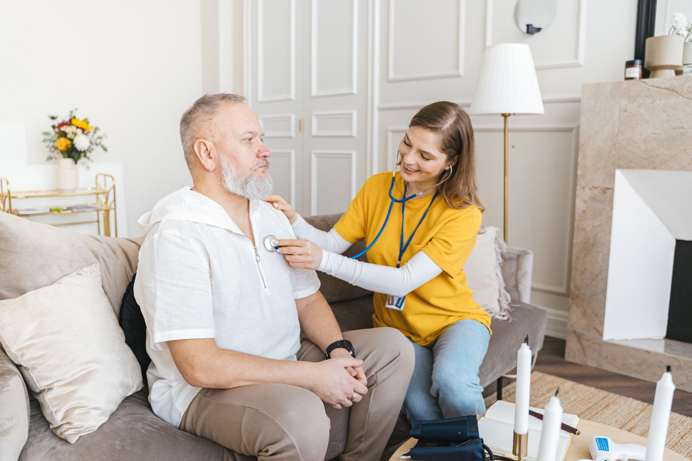 Caregiver sharing a warm moment with an older adult at home
